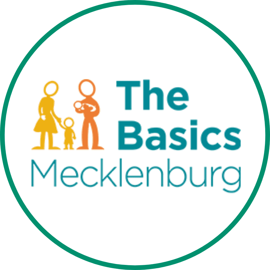 The Basics Mecklenburg logo in a white circle with a green outline.